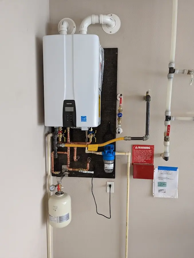 Professional plumber installing copper piping in a Greencastle home